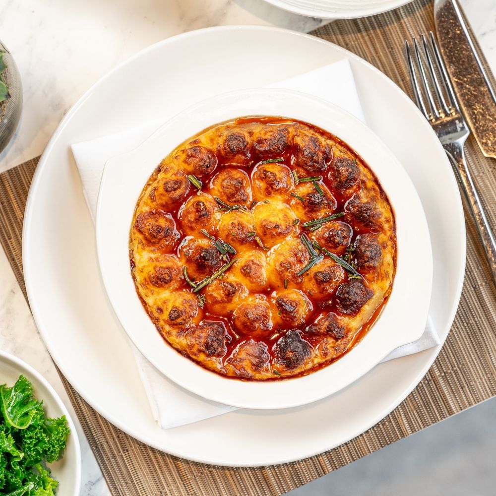 Origin Kensington is a modern British restaurant paying homage to quality and local ingredients, offering signature dishes such as Shepherd's Pie.