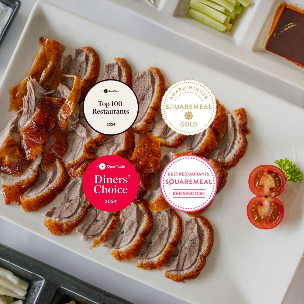 Award-winning Min Jiang offering signature Wood-Fired Beijing Duck sliced on tableside.