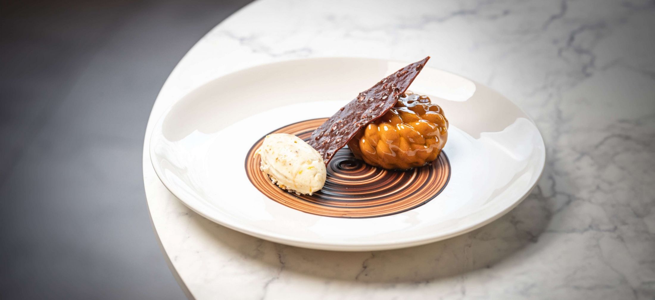 The Origin Overnight Package offers a luxury stay at Royal Garden Hotel, elevated by the refined British dining experience at Origin Kensington.
