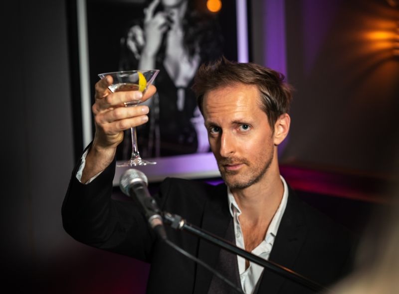 Pianist performing live piano at Piano Kensington cocktail bar.